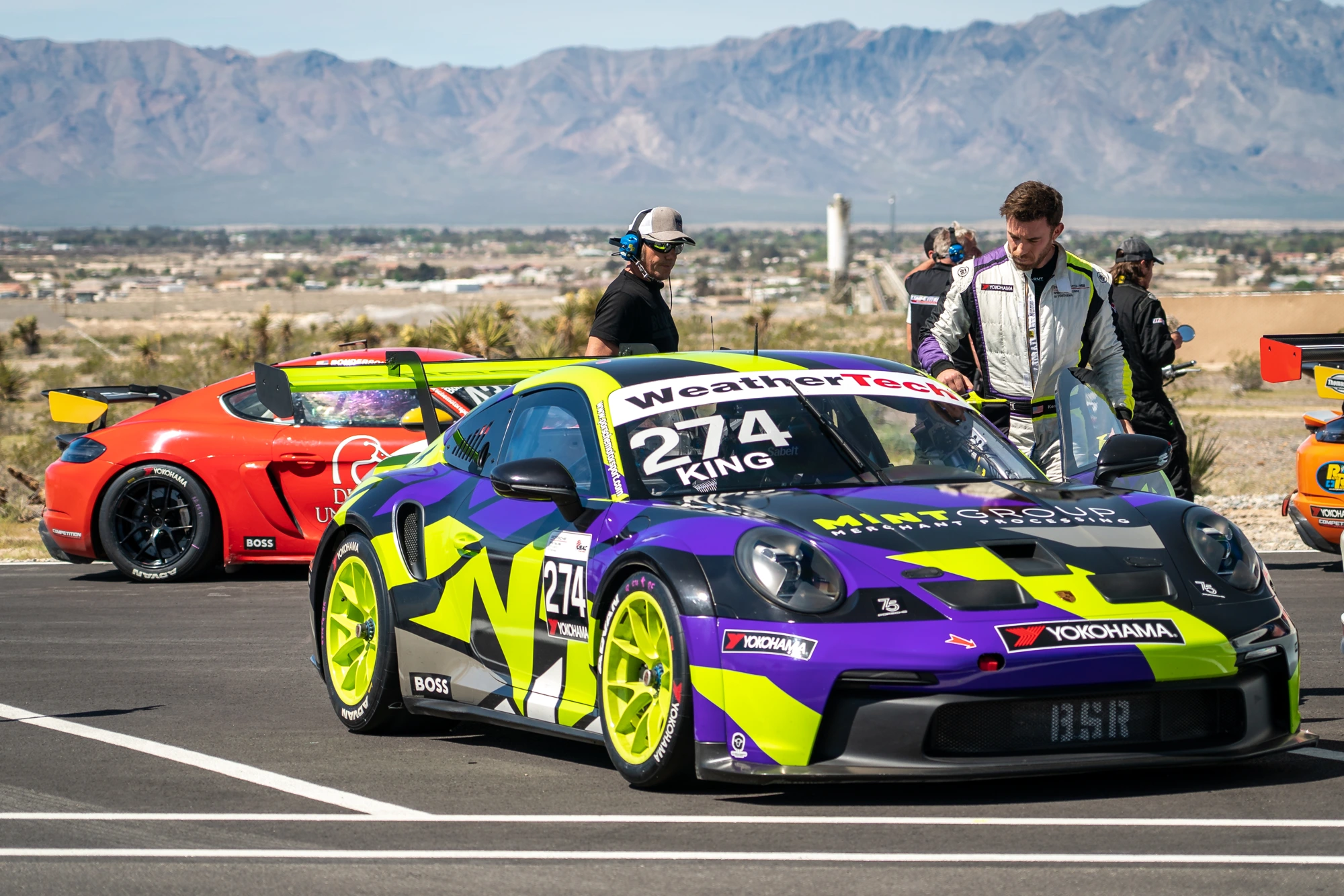 Vivid purple and lime number 274 Porsche on the grid at Spring Mountain
