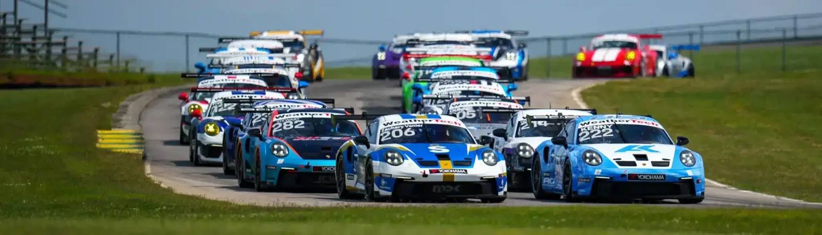 Porsche Sprint Challenge cars competing on circuit